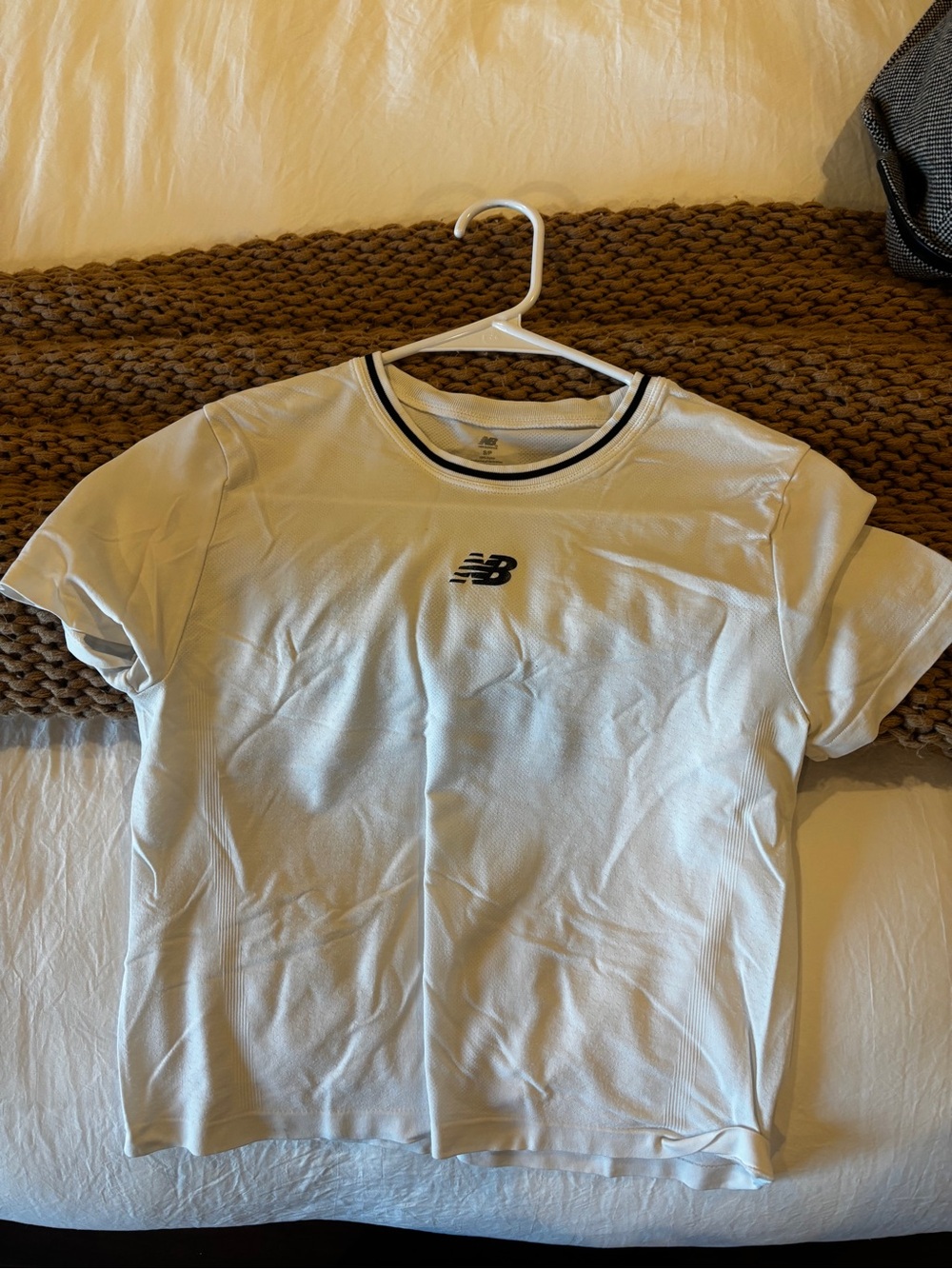 New Balance White Short Sleeve Tee with Black Logo and Neck Trim